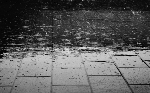 Rain falling on pavement